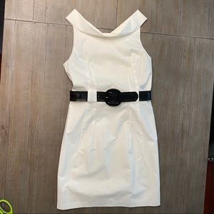 White fitted cocktail dress with belt.